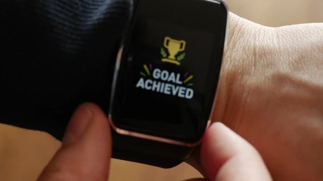 golden cup, goal achieved on smartwatch screen