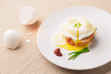 Breakfast is Eggs Benedict - toasted English muffins, bacon, ham, poached eggs, herbs and delicious buttery hollandaise sauce.