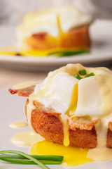 Breakfast is Eggs Benedict - toasted English muffins, bacon, ham, poached eggs, herbs and delicious buttery hollandaise sauce.