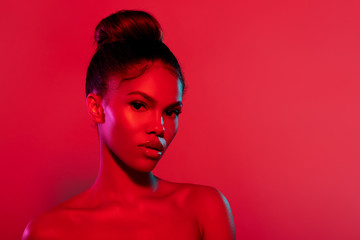 Beauty fashion portrait with color lighting filters. red portrait. Beauty girl face close up....