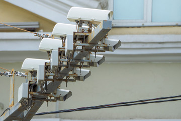 Modern speed control camera close-up on the background blue sky.