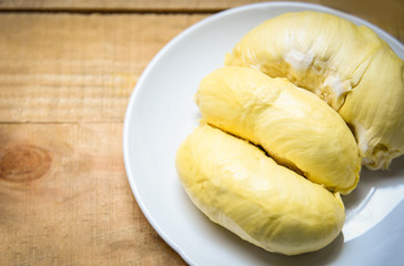 Durian riped - Fresh durian peel tropical fruit summer on white plate and wooden background