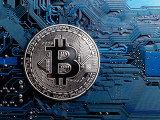Concept of Bitcoin Mining. Physical bit coin. Digital currency. Cryptocurrency. Silver  bitcoins...