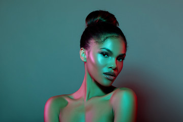 Beauty portrait fashion girl with color lighting filters. Beauty girl face close up. Closeup...