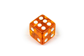 Dice of caramel color isolated on white with shadow. Six, top view.