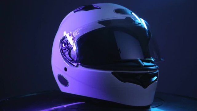 Motorcycle full-face helmet rotation, concept of head protection.