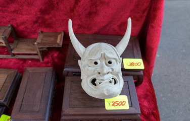 Wood jewelry boxes and devil mask at Flea Market near Osu Kannon temple in Nagoya, Japan