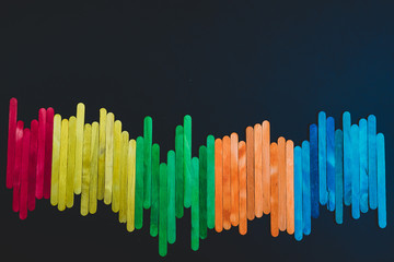 Colorful sticks isolated on black background