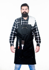Planning a BBQ. Professional hipster cook. Brutal hipster wearing grilling apron. Bearded hipster ready for preparing barbeque foods. Chef hipster