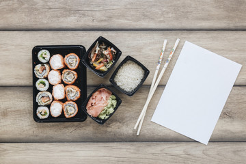 Flat lay sushi composition with paper template