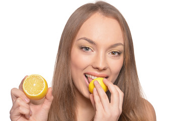 Portrait of beautiful young woman with lemon isolated