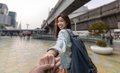 Lover Asian couple holding hands at outdoors. Romantic and travel in summer vacation concept.