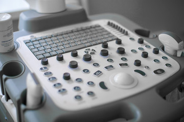 Close up in backlit high-tech ultrasound machine. Analysis, diagnosis of the condition of the disease using ultrasound scanning