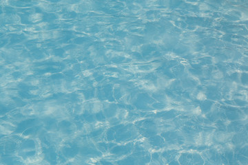 Obraz premium Blue pool water with sun reflection