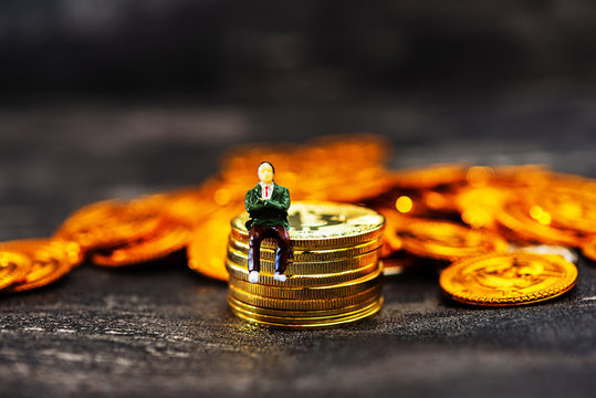 People sitting above digital currency