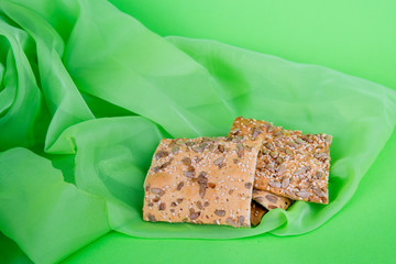 cookies on green cloth. Dietary biscuits with seeds. Puff pastry on a green background