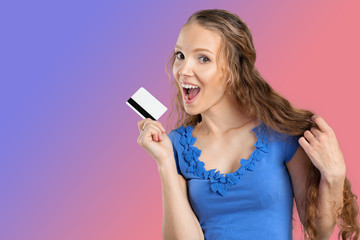 Naklejka premium beautiful young smiling woman holding credit card