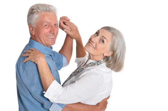 Happy Senior Couple Dancing Isolated On White Background