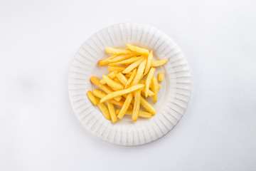 French fries on white plate isolated on white background