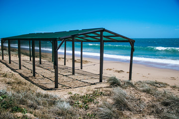 Fototapeta na wymiar Protection and surveillance enclosure for sea turtle eggs on a beach