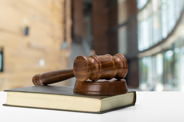 Law and justice concept image. Brown wooden background