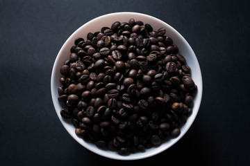 plate with coffee on black background with copy space