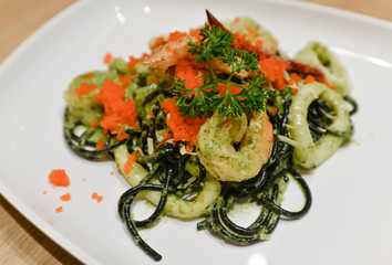 Spicy squid-ink spaghetti with seafood