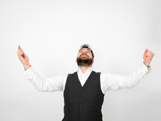 young man with black beard is posing and looking at his smartphone in front of white background with different emotions