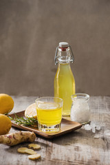 Homemade lemon and ginger organic probiotic drink, copy space.