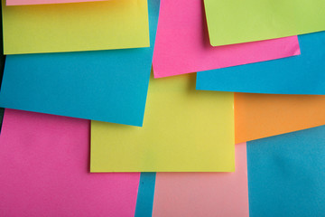 Colorful sticky notes on the blank blackboard