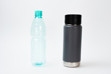  Life style zero waste. Reduced use of plastic packaging. Replacing a plastic bottle on a reusable bottle. White background