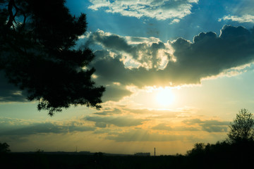 Fototapeta na wymiar sunset panorama with magic clouds