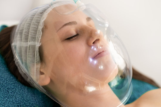 Woman On Cosmetic Treatment With Oxygen Mask