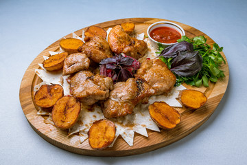 Kebab of pork on board