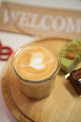 coffee and desserts are on wooden station...