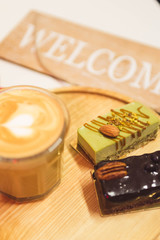 coffee and desserts are on wooden station...