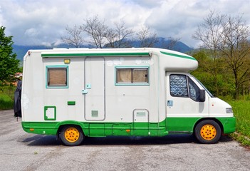 parked retro car caravan white-green color