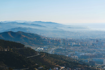 barcelona and hills in smog