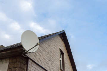 the satellite antenna installed on a house facade