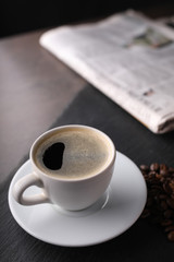 Coffee and newspaper. Relax with a cup of aromatic coffee.