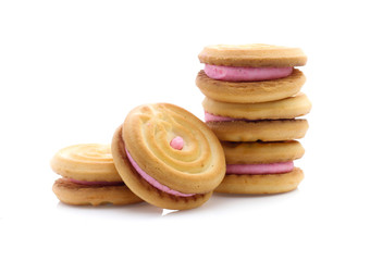 sandwich cookies with strawberry cream on white background