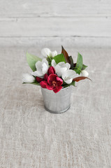 spring flowers in a bucket
