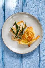 Sea bass fillet with parsnip crisp and samphire 