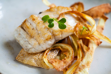 Sea bass fillet with parsnip crisp and samphire 