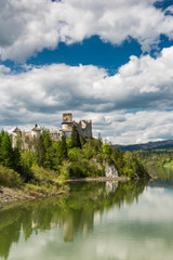 Fototapeta na wymiar Niedzica castle on hill top at Czorsztyn lake and Dunajec river in Poland