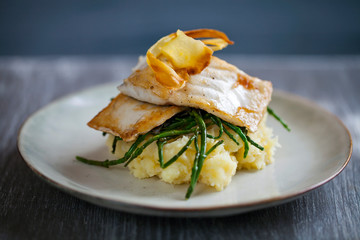 Sea bass fillet with parsnip crisp and samphire 