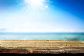Desk of free space and summer background of sea 