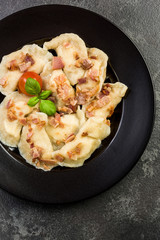 Traditinal Polish meat dumplings, served on plate in restaurant