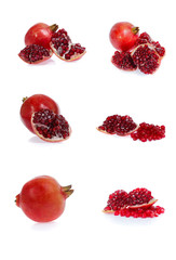 Set of pomegranate fruits with green leaf and cuts isolated on white background