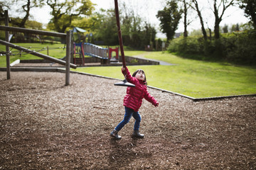 toddler girl play at outdoor playground